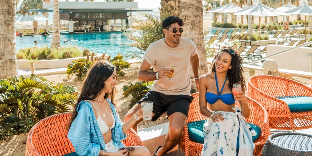 Guests enjoying cocktails at a resort swim-up pool bar