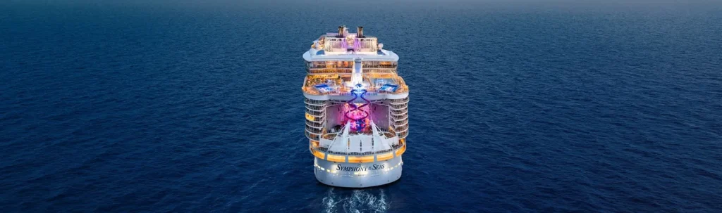 Symphony of the Seas sailing at dusk for St. Louis cruise travelers