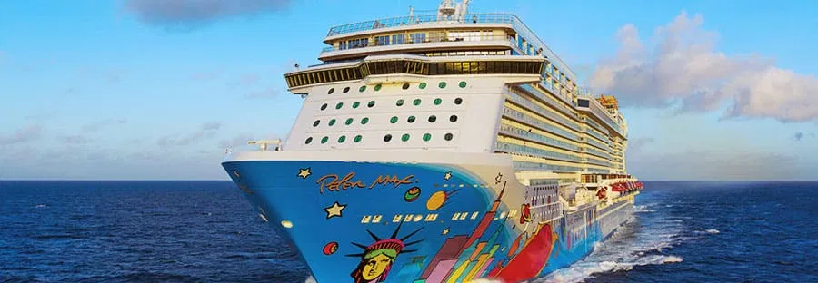 Norwegian Getaway cruise ship with colorful hull mural sailing on the ocean